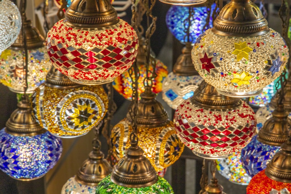 a bunch of colorful lights hanging from a ceiling