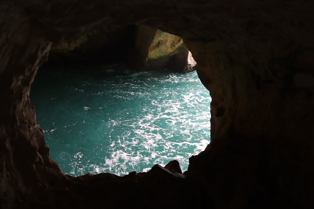 a view of the ocean from inside a cave