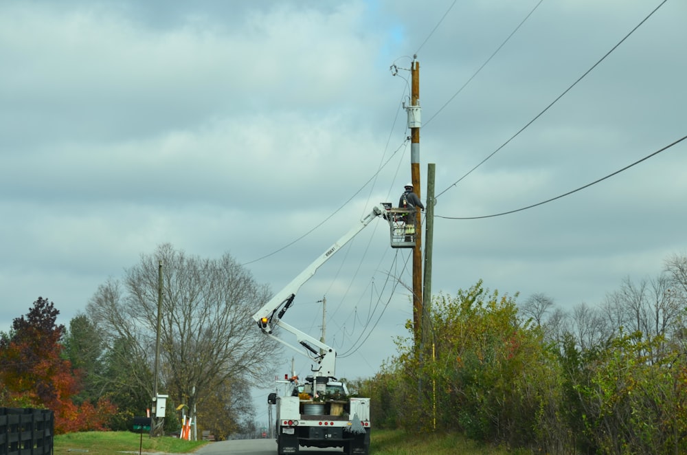a utility truck is working on a power line