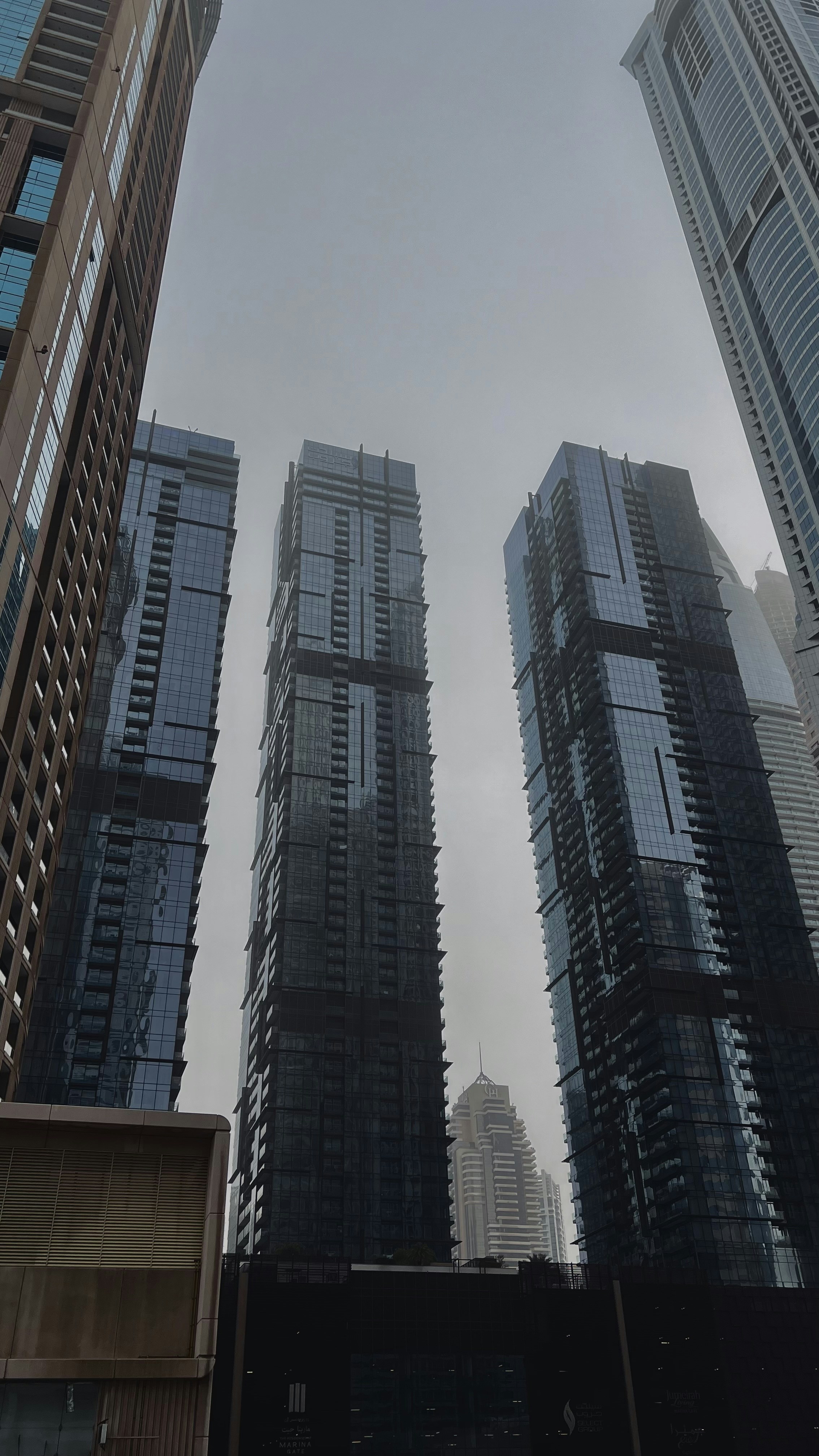 a couple of tall buildings sitting next to each other