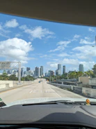 City skyline viewed from a car window during a smooth ride.