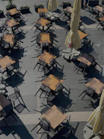 A panoramic view of a stylish café terrace with parchment-colored furnishings captured in high resolution.