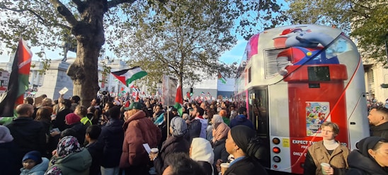 A campaign image of Mo London speaking to a diverse crowd in London.