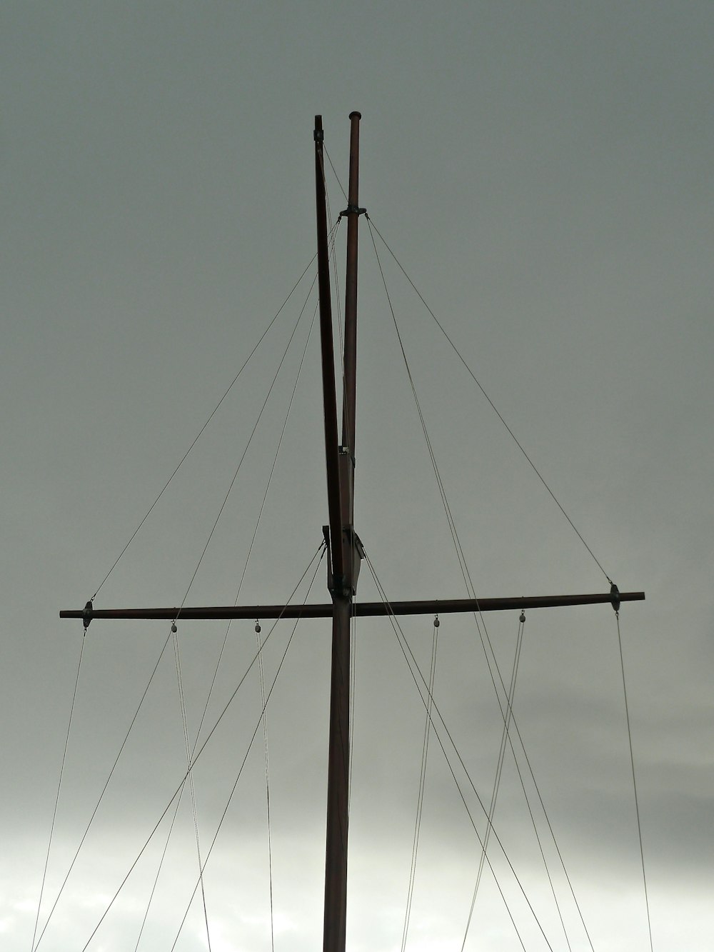 a large wooden cross on top of a pole