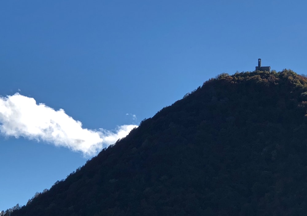 a hill with a cross on top of it
