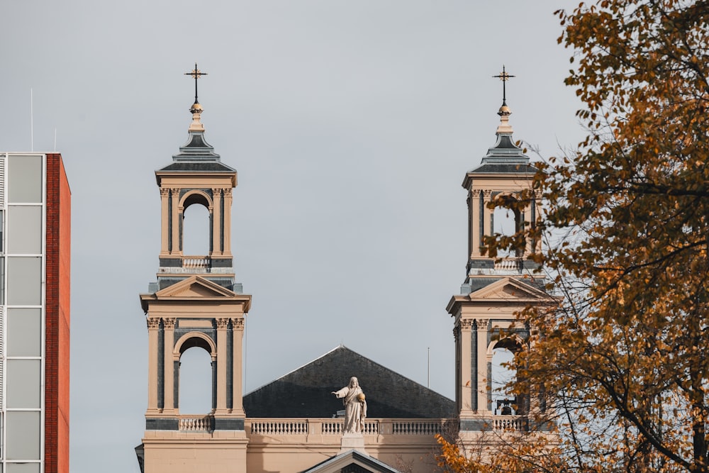 a church with two towers and a statue on top