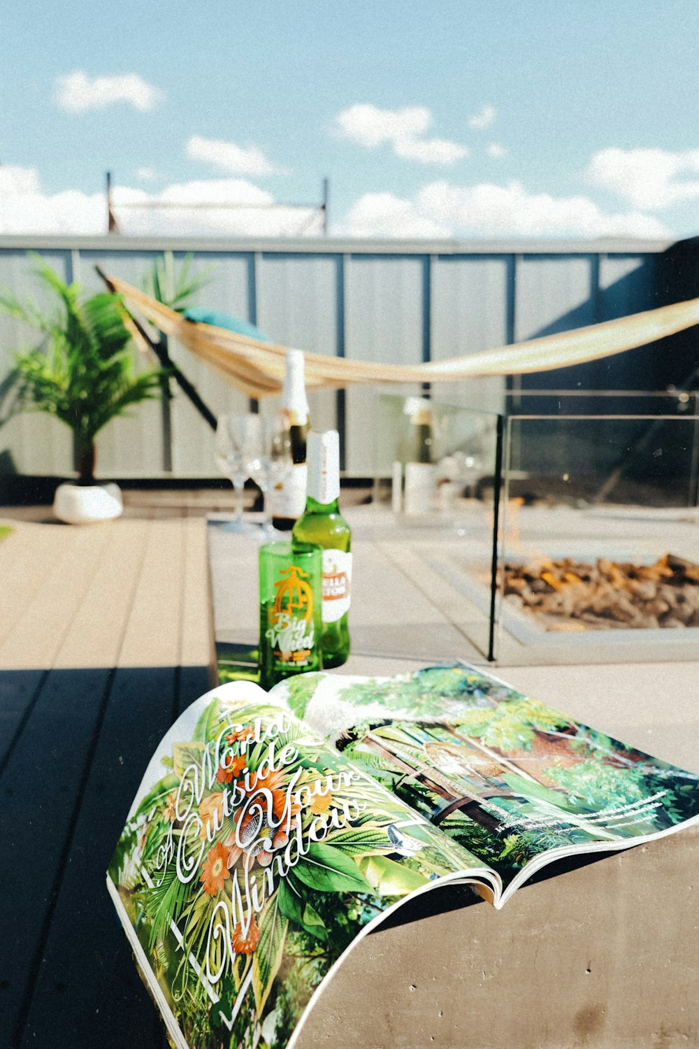 a bottle of beer sitting on top of a wooden table