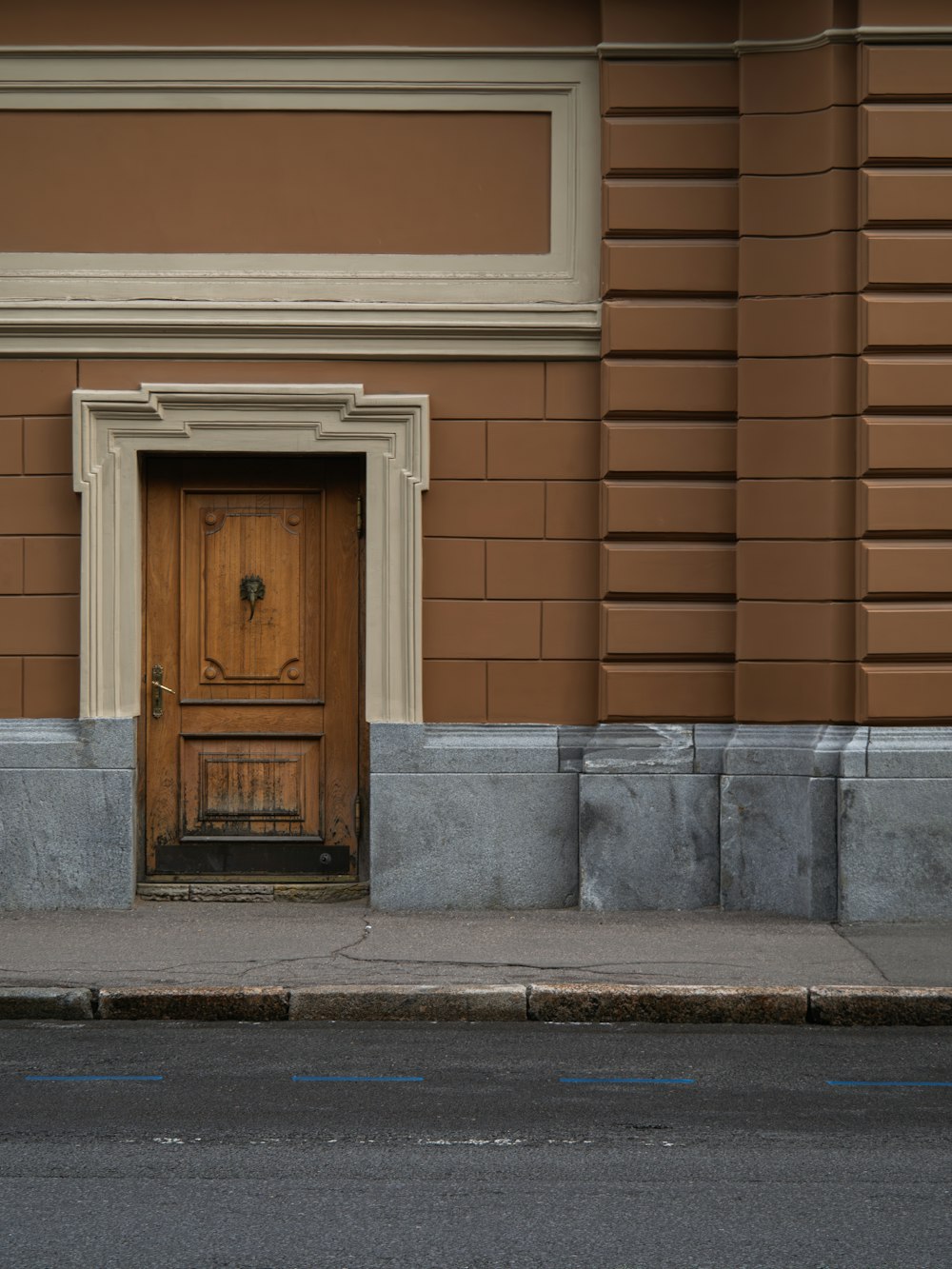 a wooden door on the side of a building