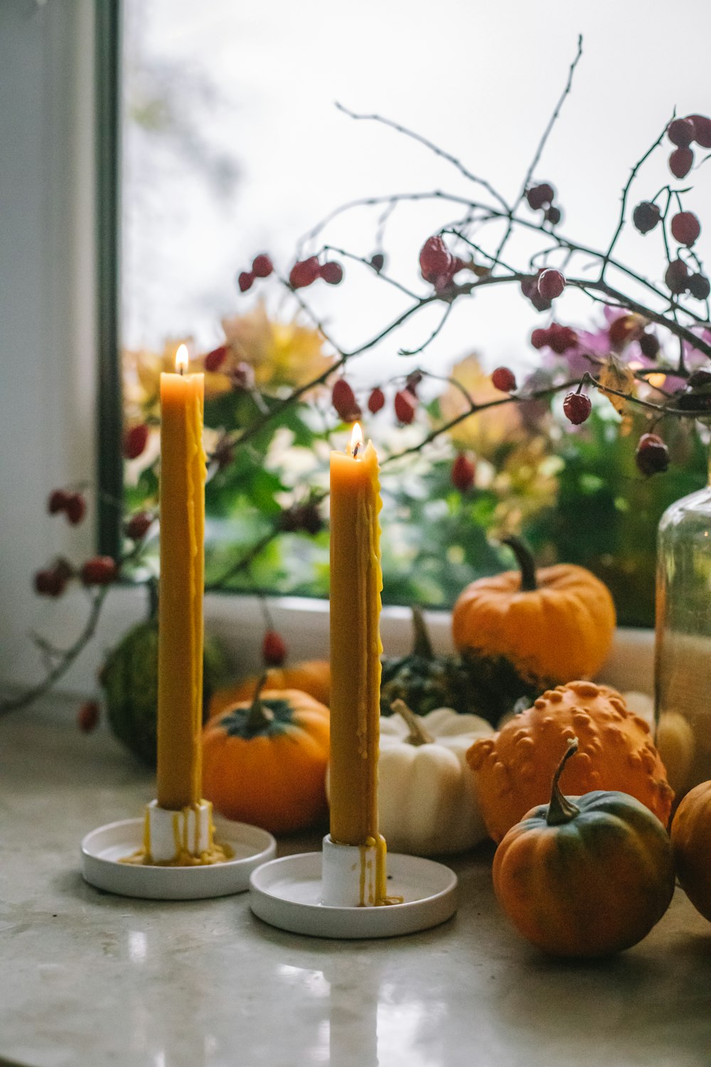 a couple of candles sitting on top of a counter