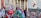 A large crowd of people is gathered outside a building with columns, holding flags and signs. The flags include Turkish and Palestinian national flags. The participants appear to be engaged in a demonstration or protest.