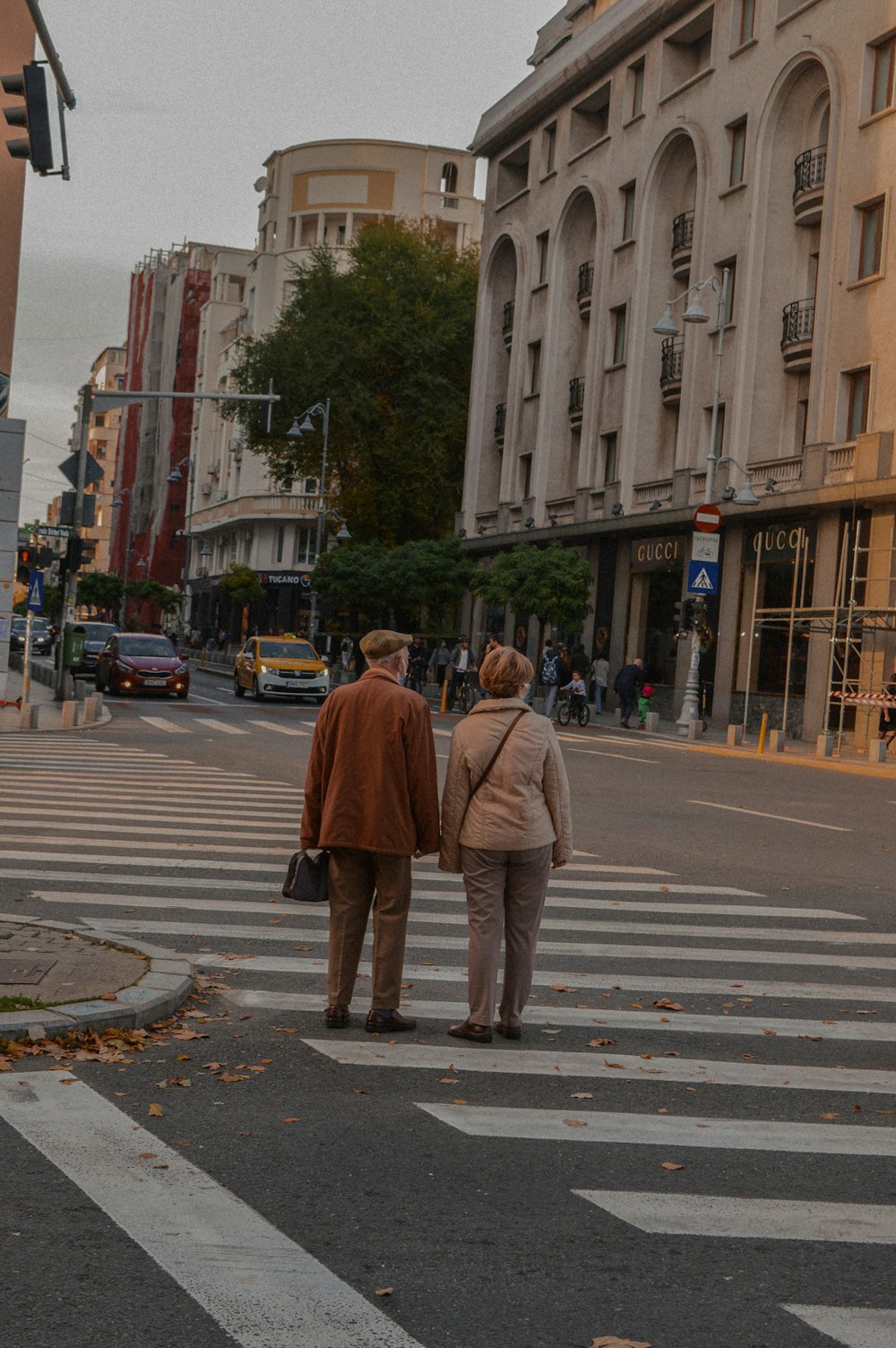 a couple of people that are standing in the street