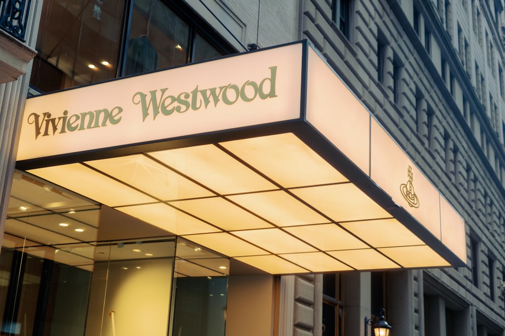 a building with a lit up sign that says whinene westwood