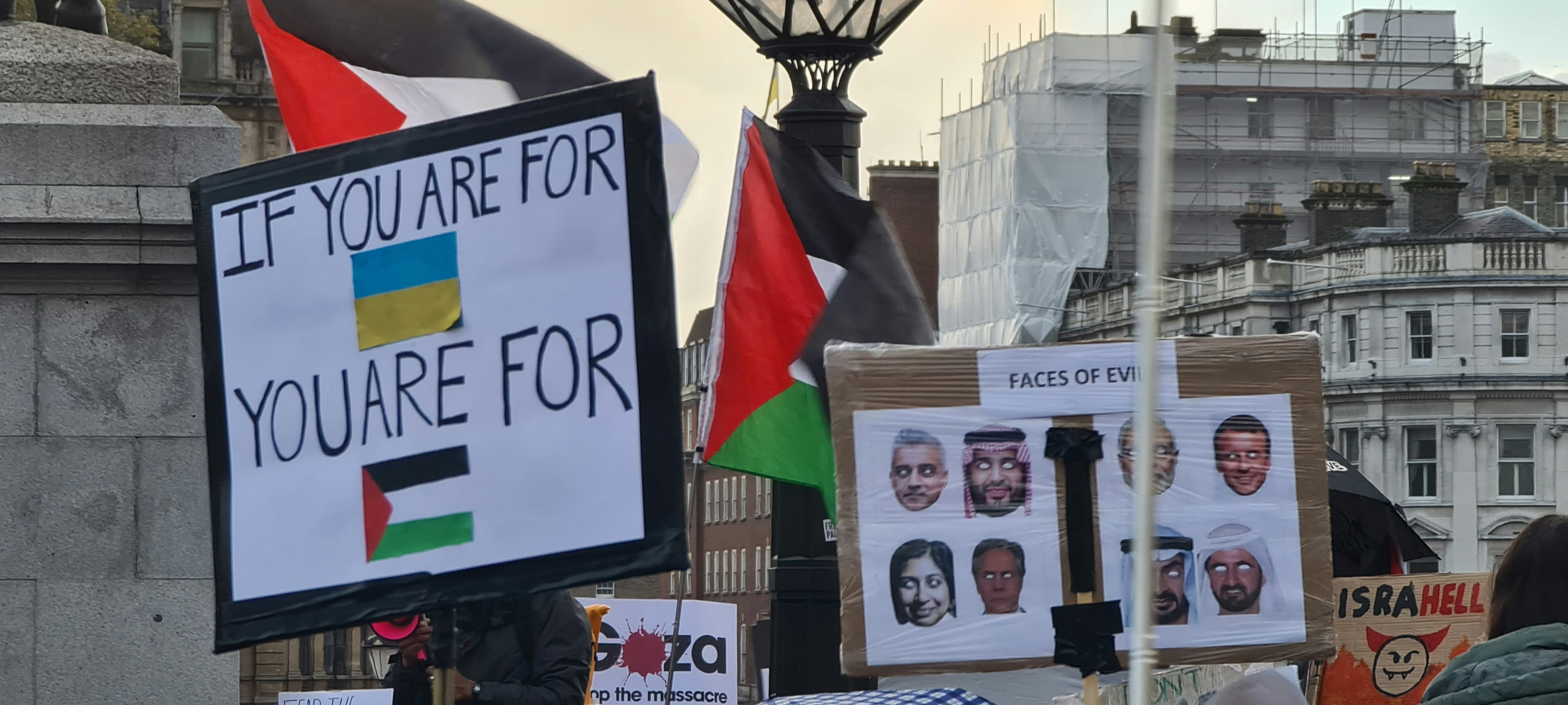 A group of people holding signs and flags photo – Free Protest Image on ...