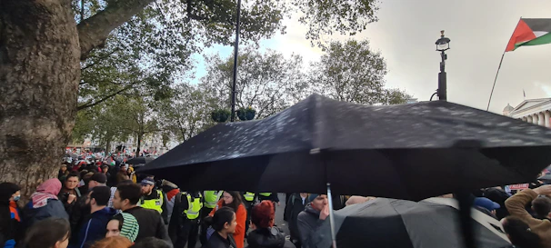 A team of security personnel coordinating during a large outdoor event.