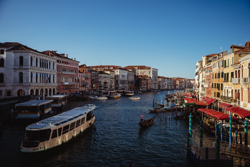 a waterway with boats and buildings on both sides