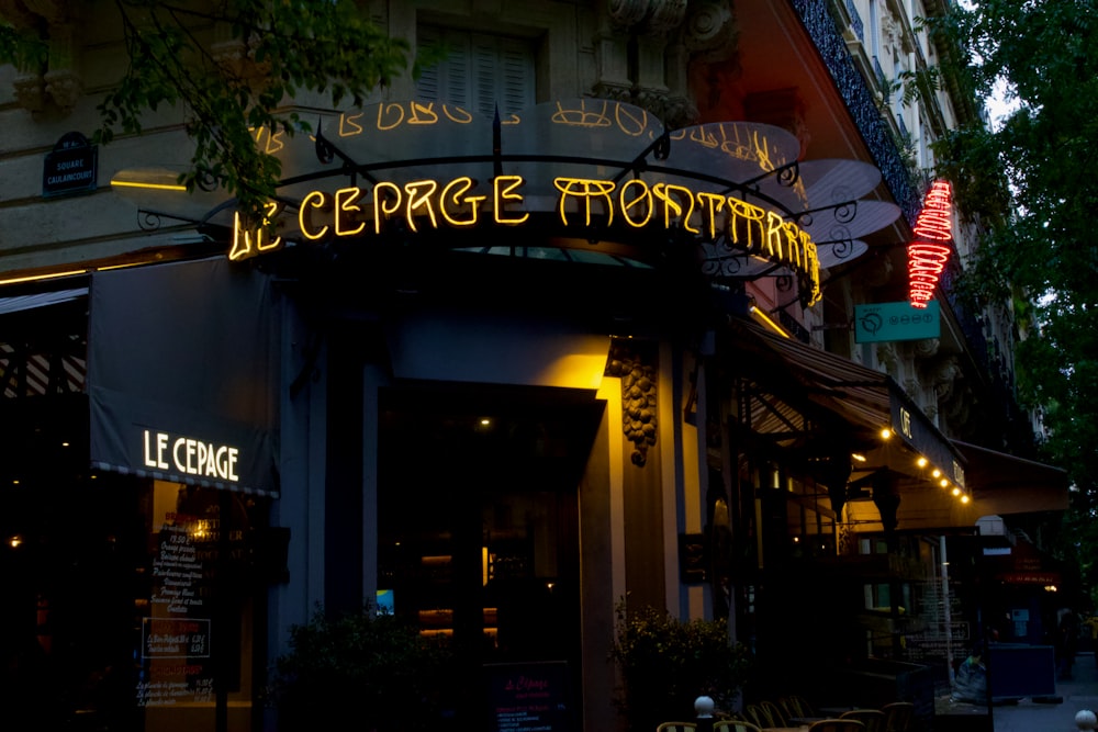 a building with a neon sign on the front of it