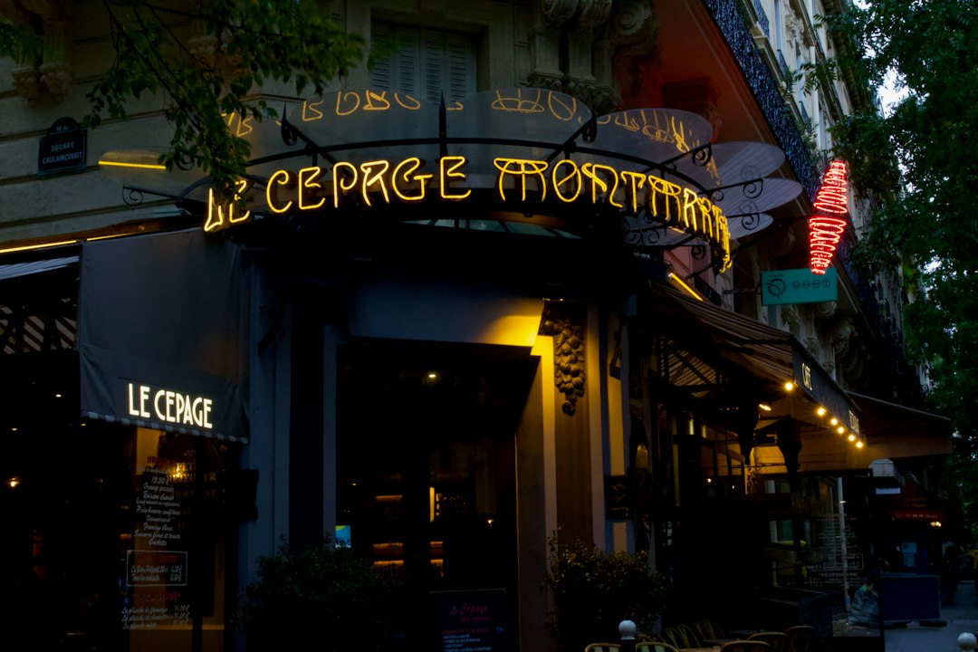 a building with a neon sign on the front of it,