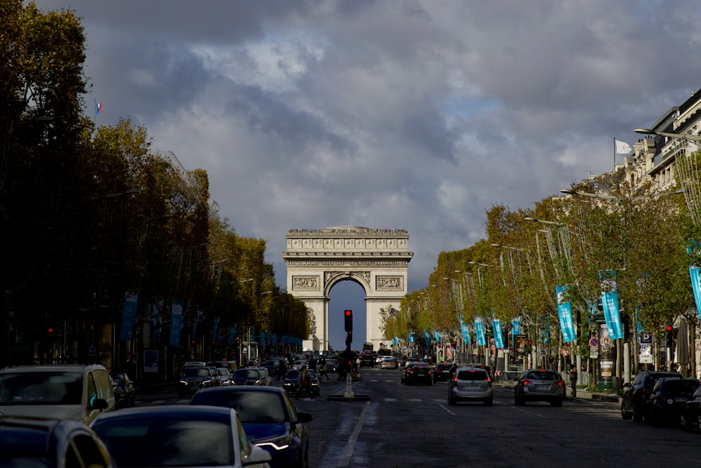 a city street with cars parked on both sides of it