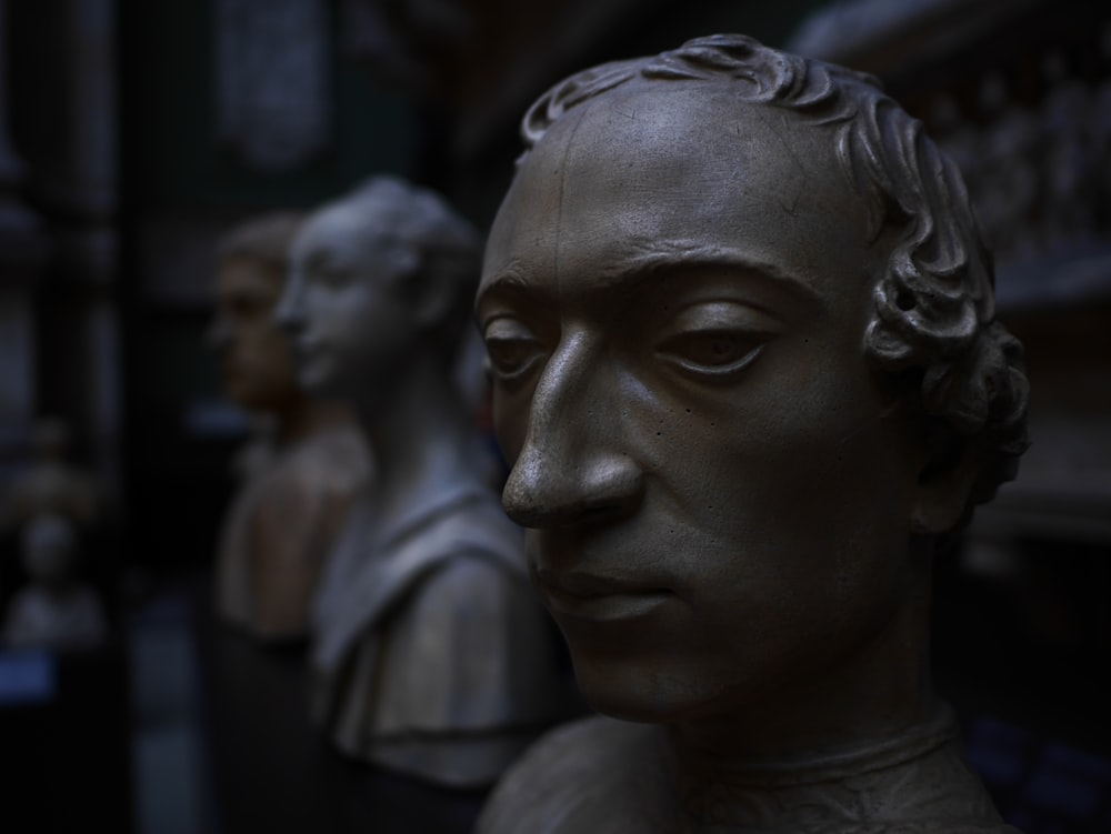 a close up of a statue of a man's head