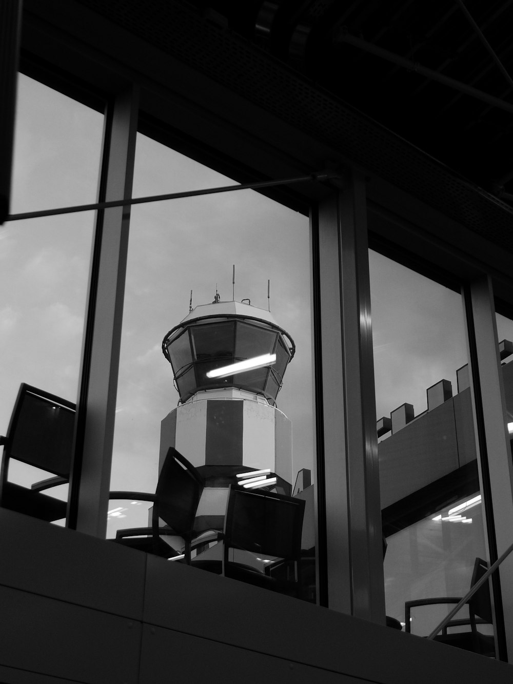 a black and white photo of a control tower