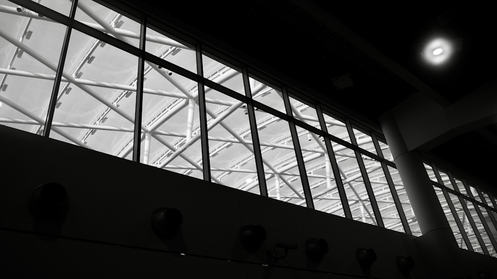 a black and white photo of a large window