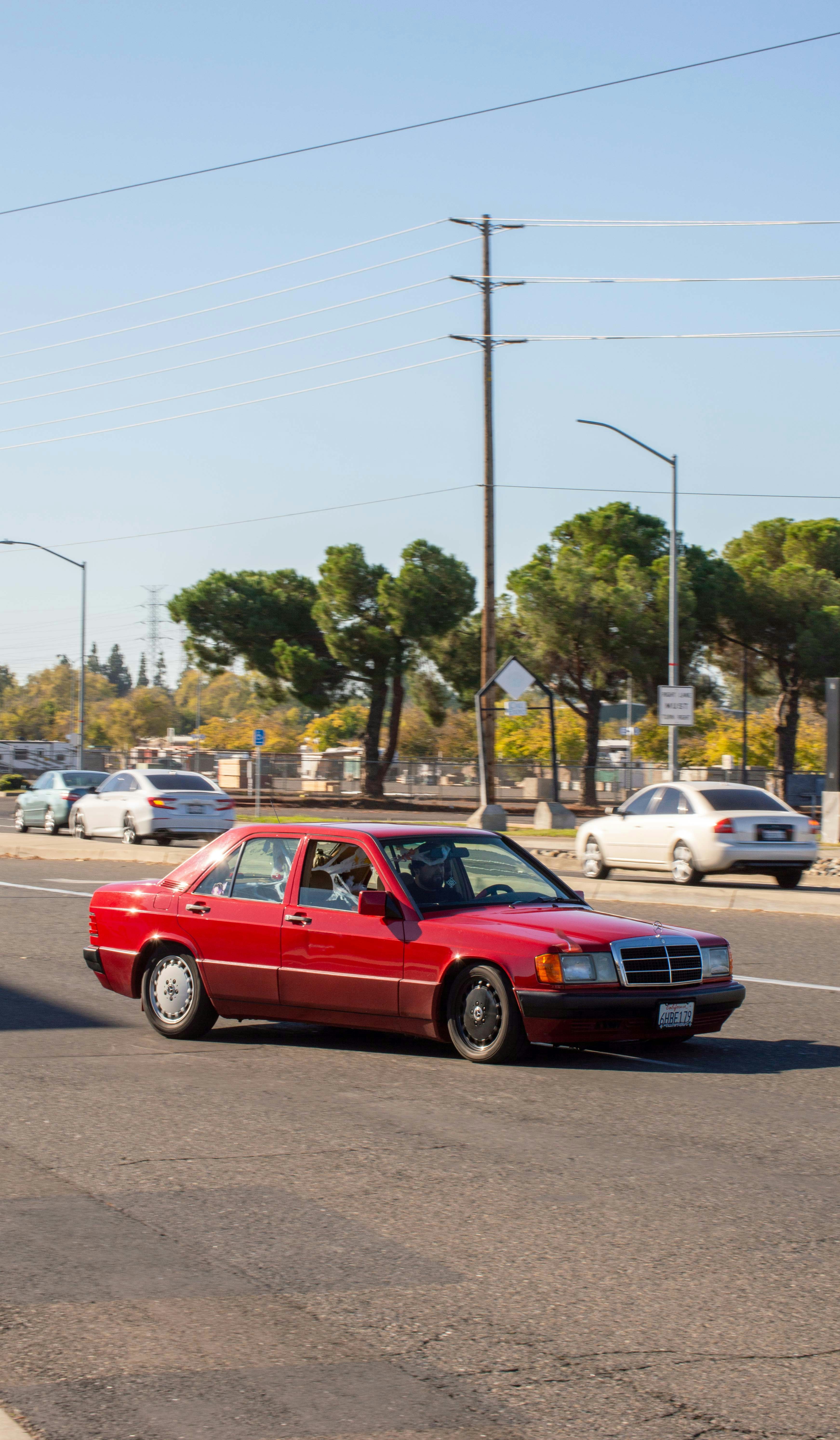 Modern sedan on a clean suburban road in Georgia, bright sunny day, open road