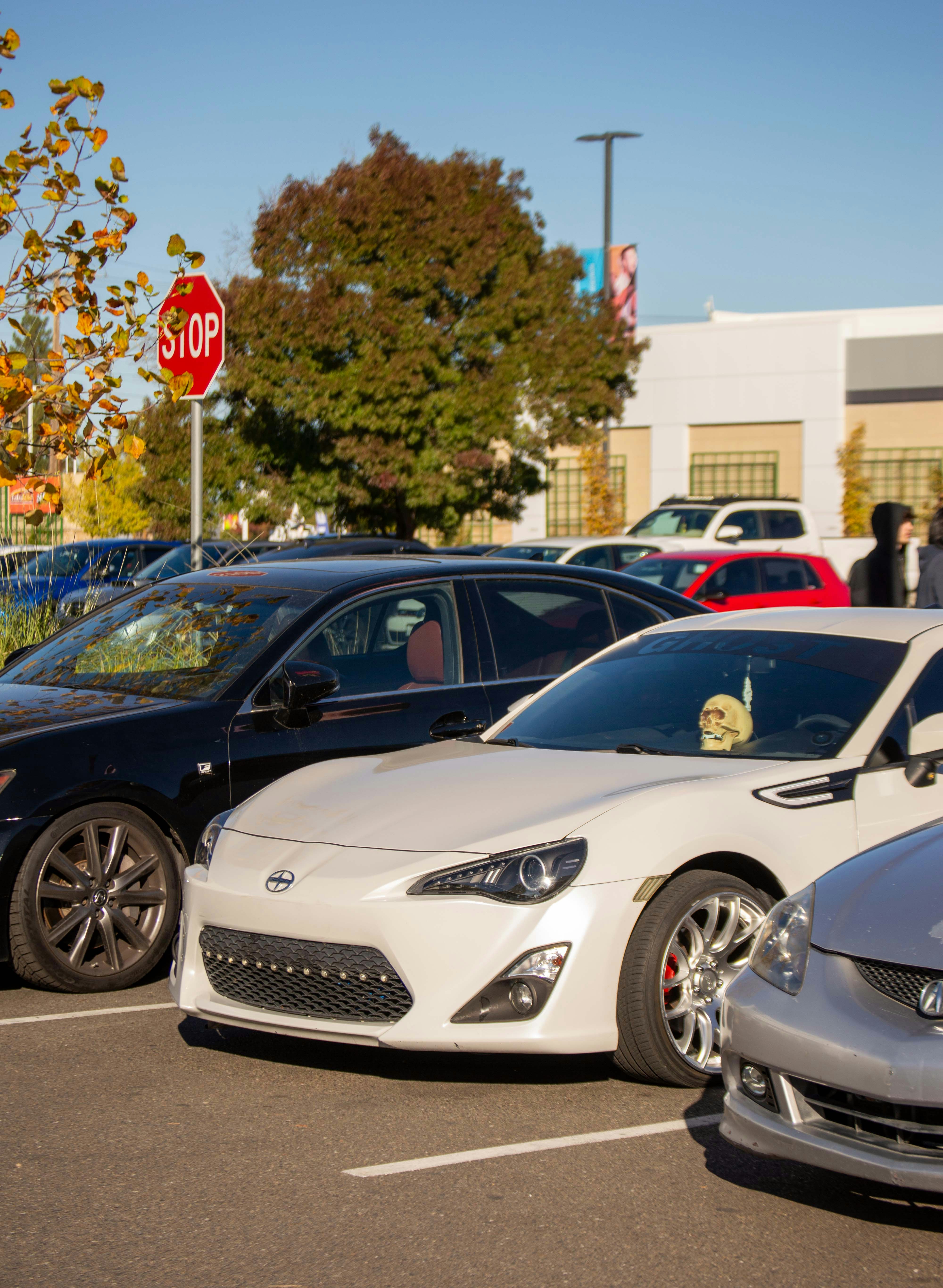 a couple of cars parked in a parking lot