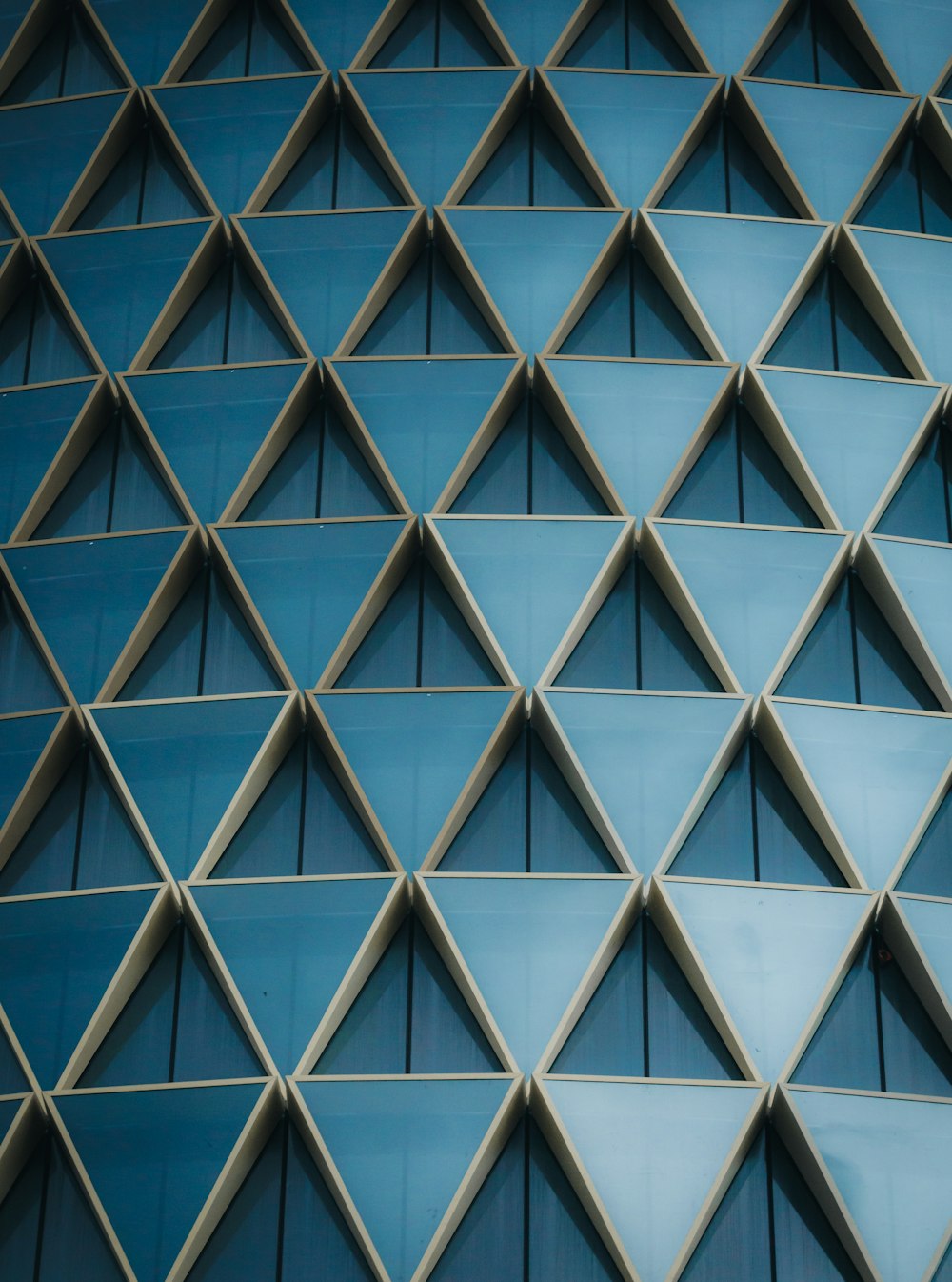 a close up of a building with a blue wall