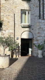 a brick building with a door and windows
