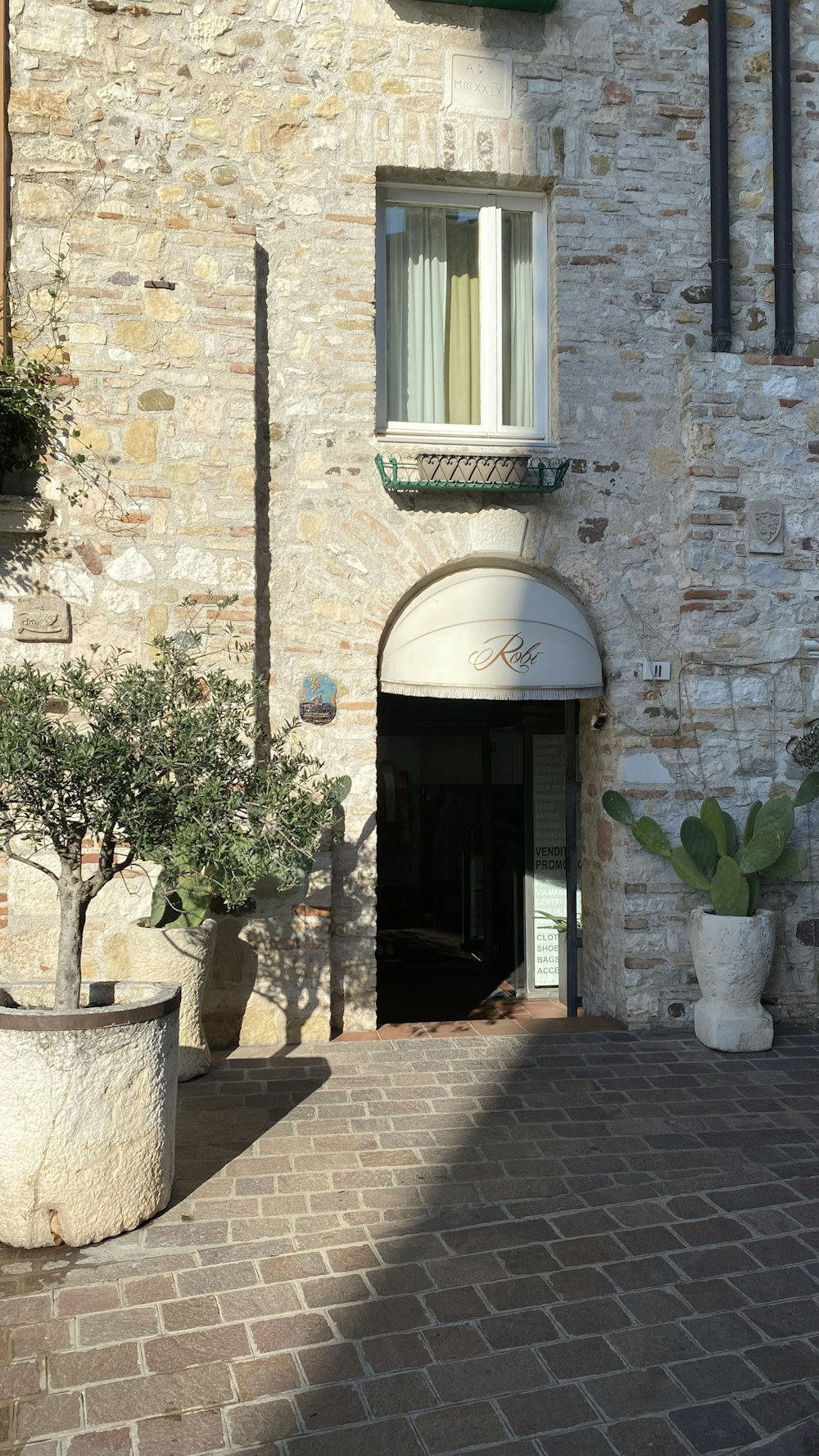 a brick building with a door and windows