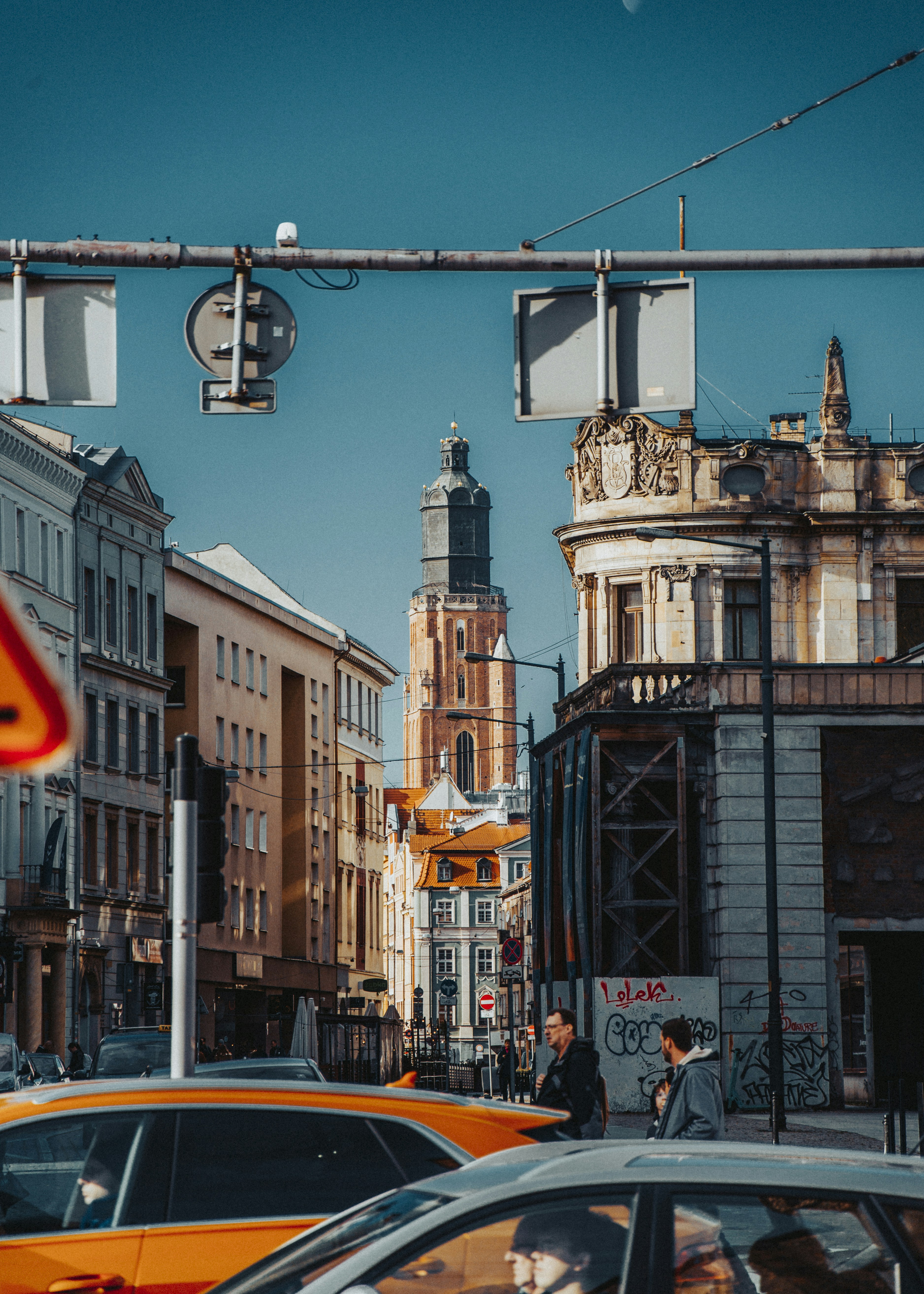 A city street filled with traffic next to tall buildings photo – Free ...