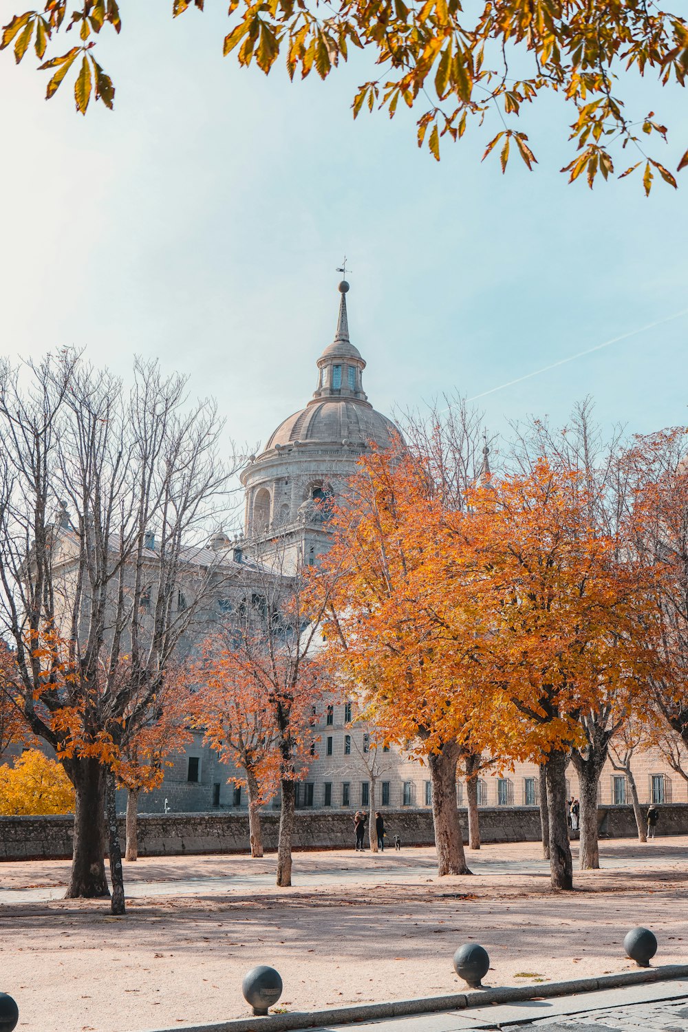 a large building with a clock tower in the background