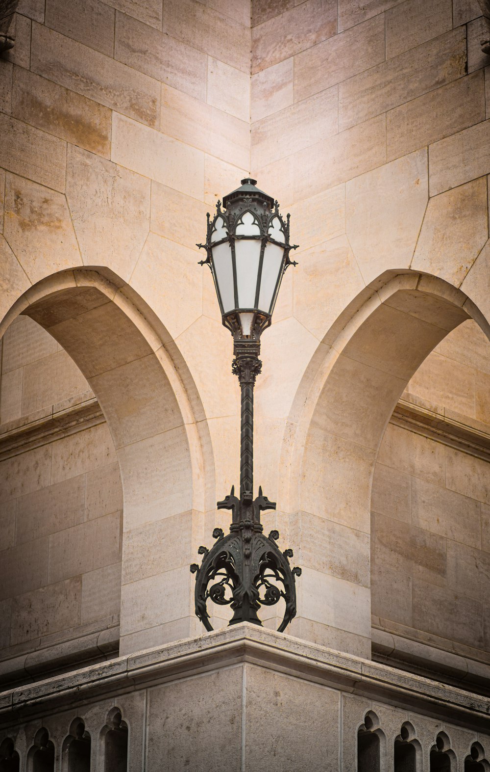 a street light on a pole in front of a building