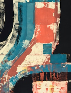 An abstract painting featuring bold, wide brushstrokes in black, blue, and red overlapping a textured beige surface. The composition is dynamic, with sweeping arcs and intersecting rectangles creating a sense of movement.