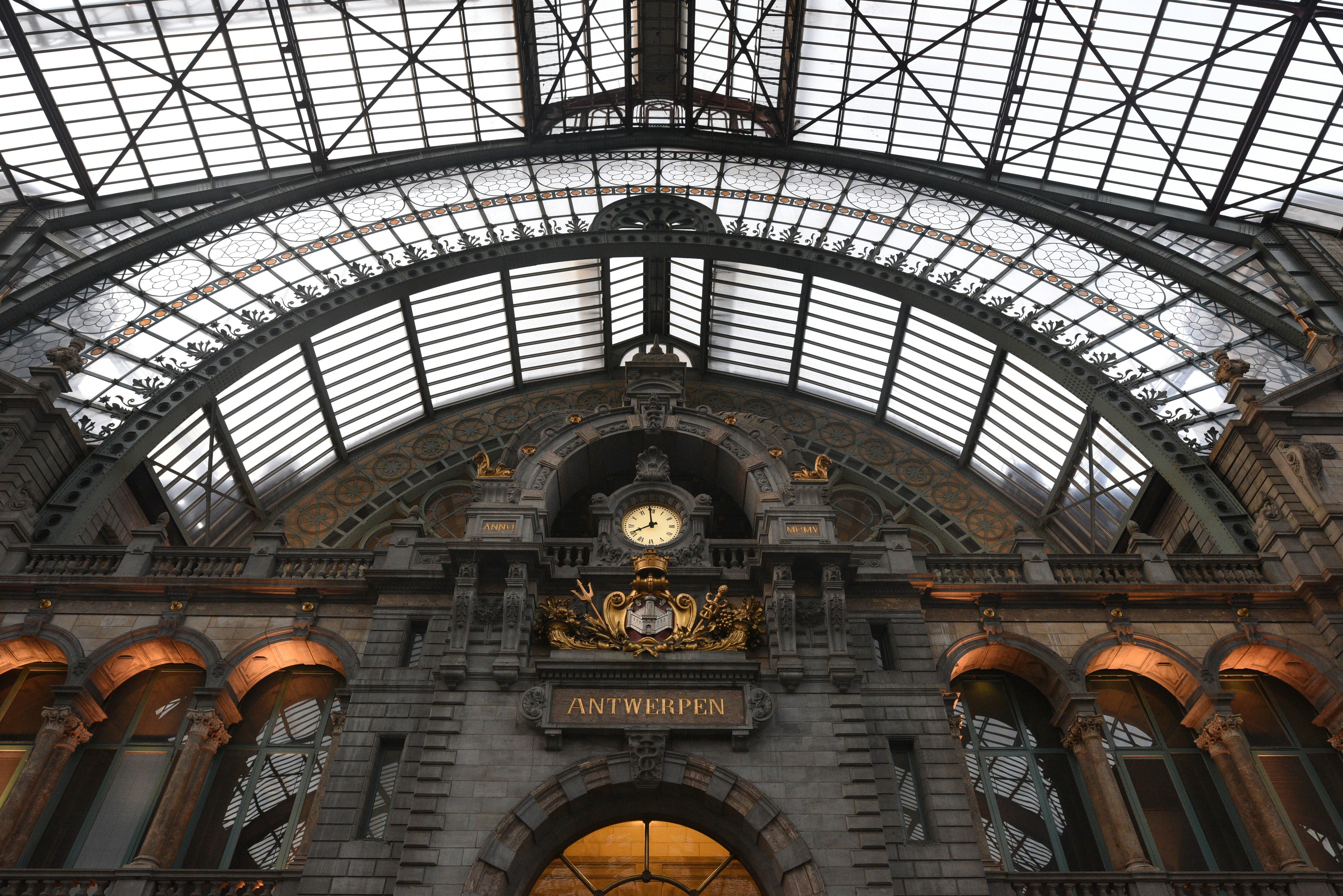 a clock mounted to the side of a building