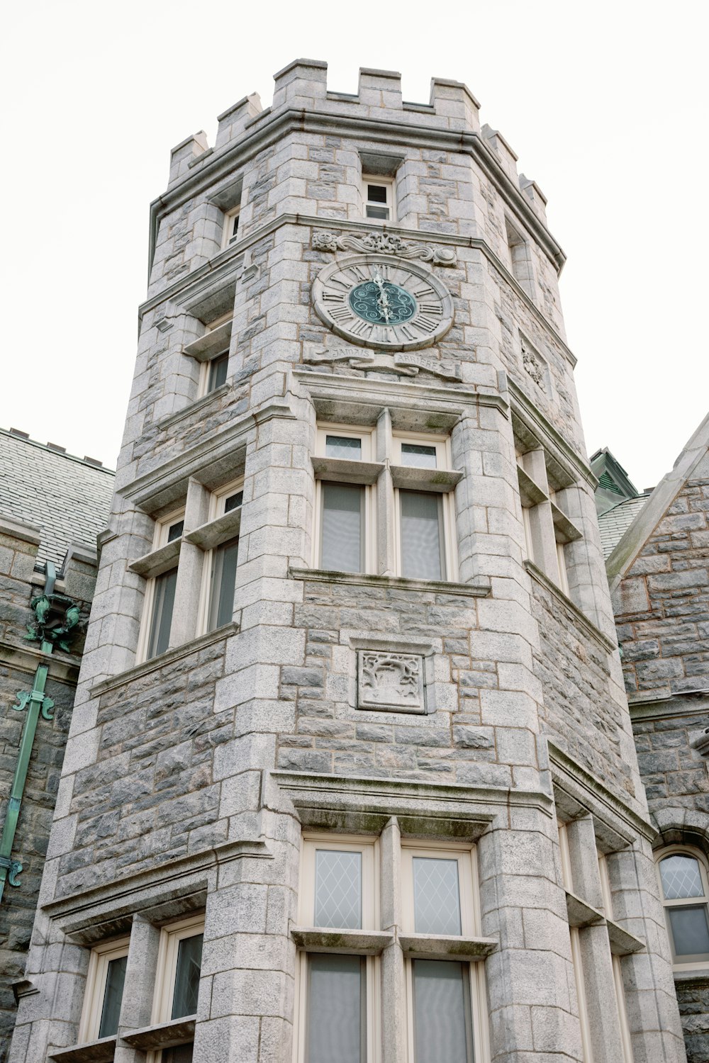 a large stone building with a clock on it's face