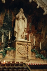 Wide shot of a marble altar with smooth, polished surfaces and ornate religious motifs.