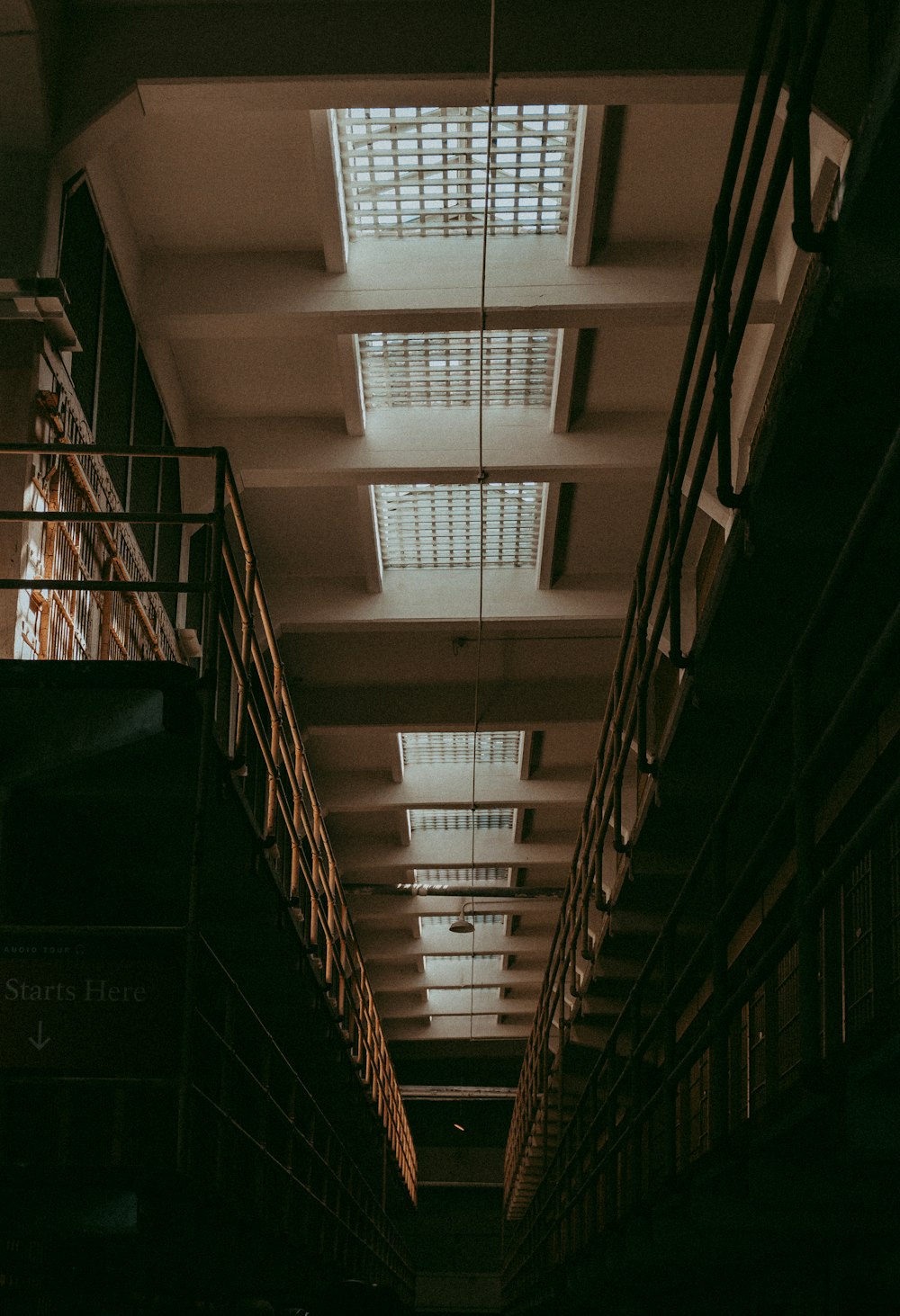 a very long room with a bunch of books on the shelves