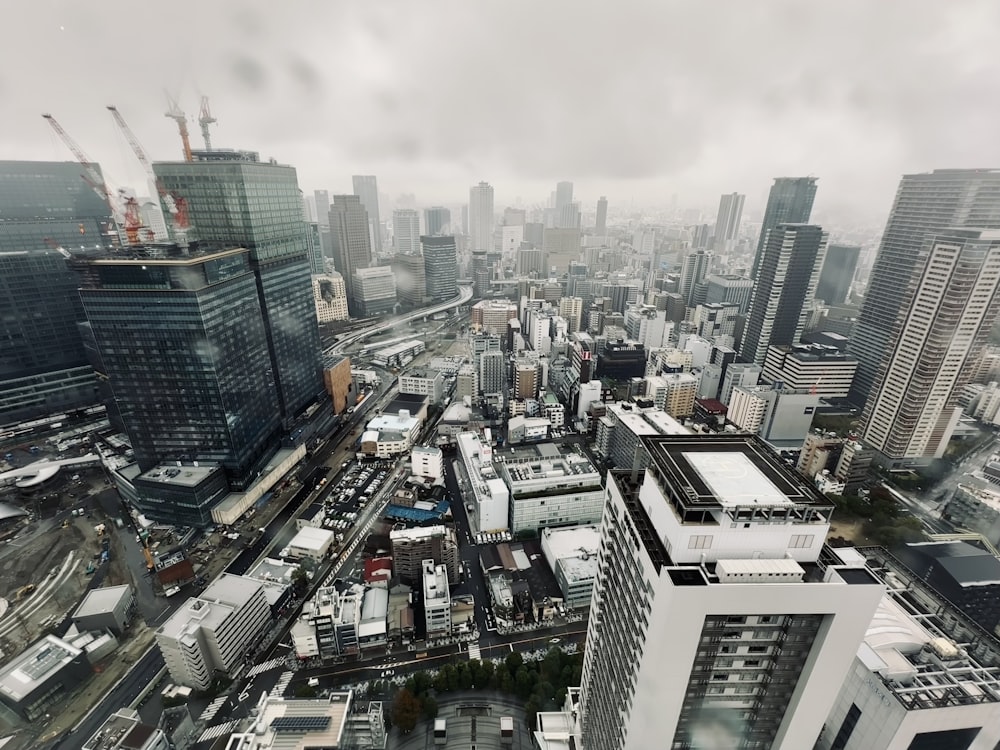 an aerial view of a city with tall buildings