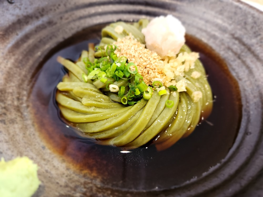 a plate of food with sauce and vegetables