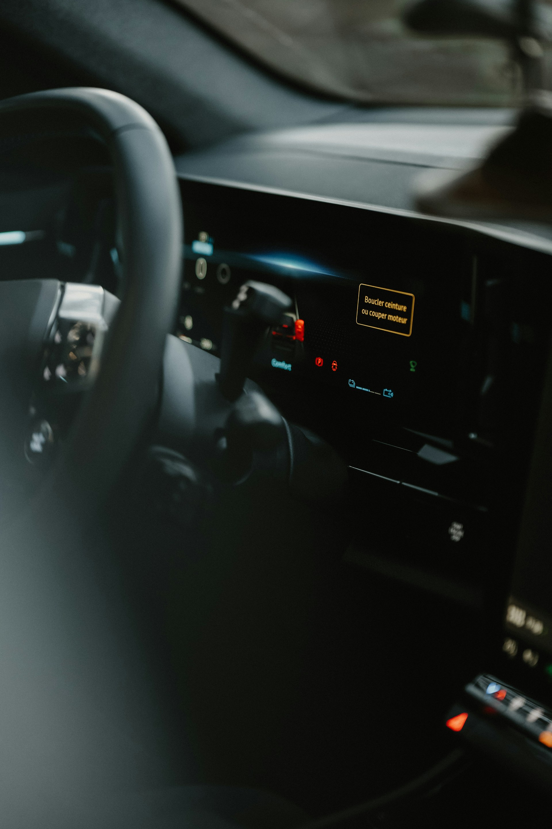 a dashboard of a car with a steering wheel