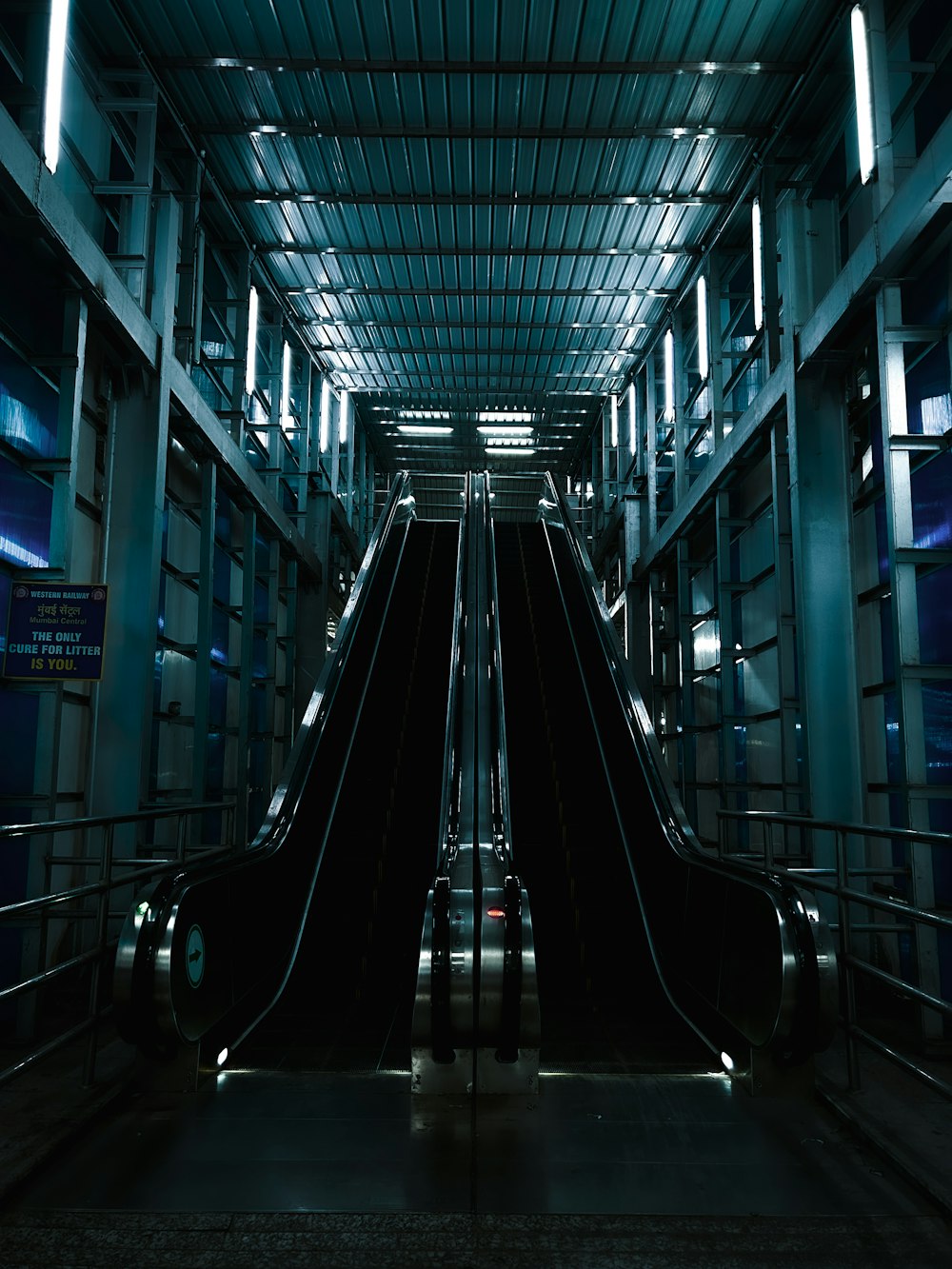 a long escalator in a large building with lots of windows