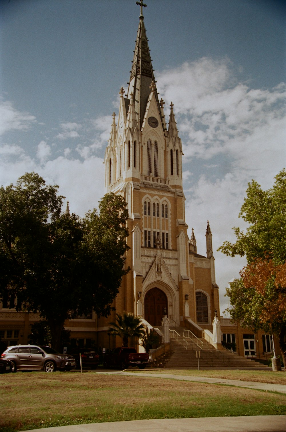a large church with a steeple and a clock tower