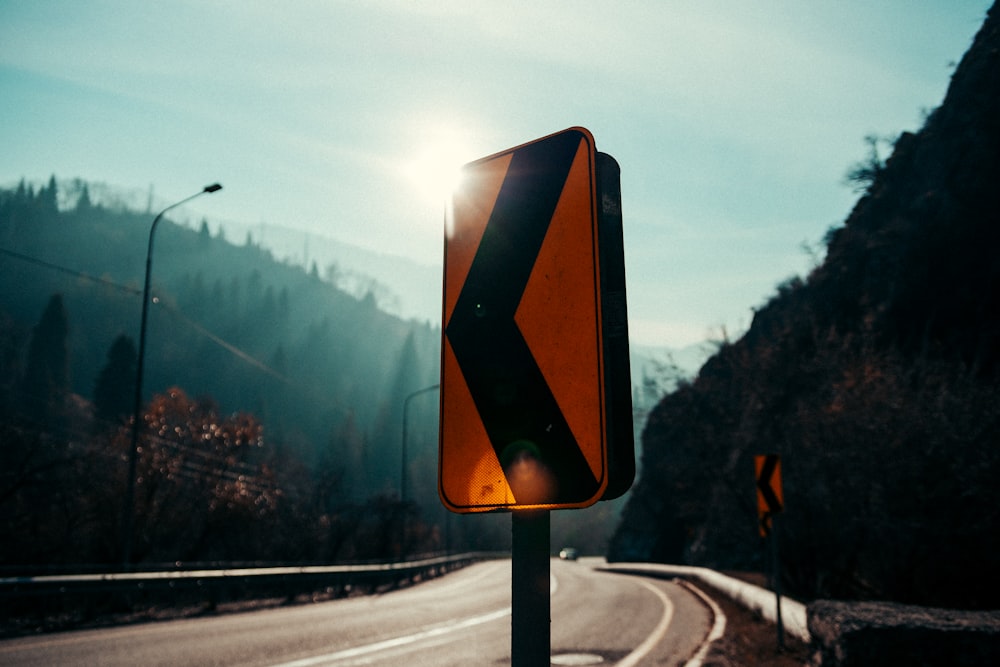 a street sign sitting on the side of a road