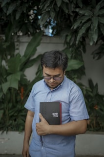 A thoughtful father reading a book.