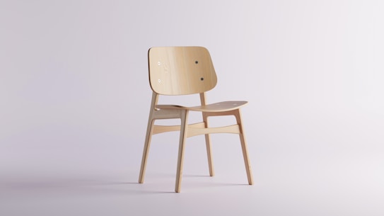 A minimalist wooden chair with a simple design, featuring a slightly curved backrest and seat. It has a light wood finish and is positioned against a plain, light background. The chair is made from smooth wooden materials with visible wood grain.