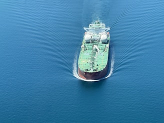 a large cargo ship in the middle of the ocean
