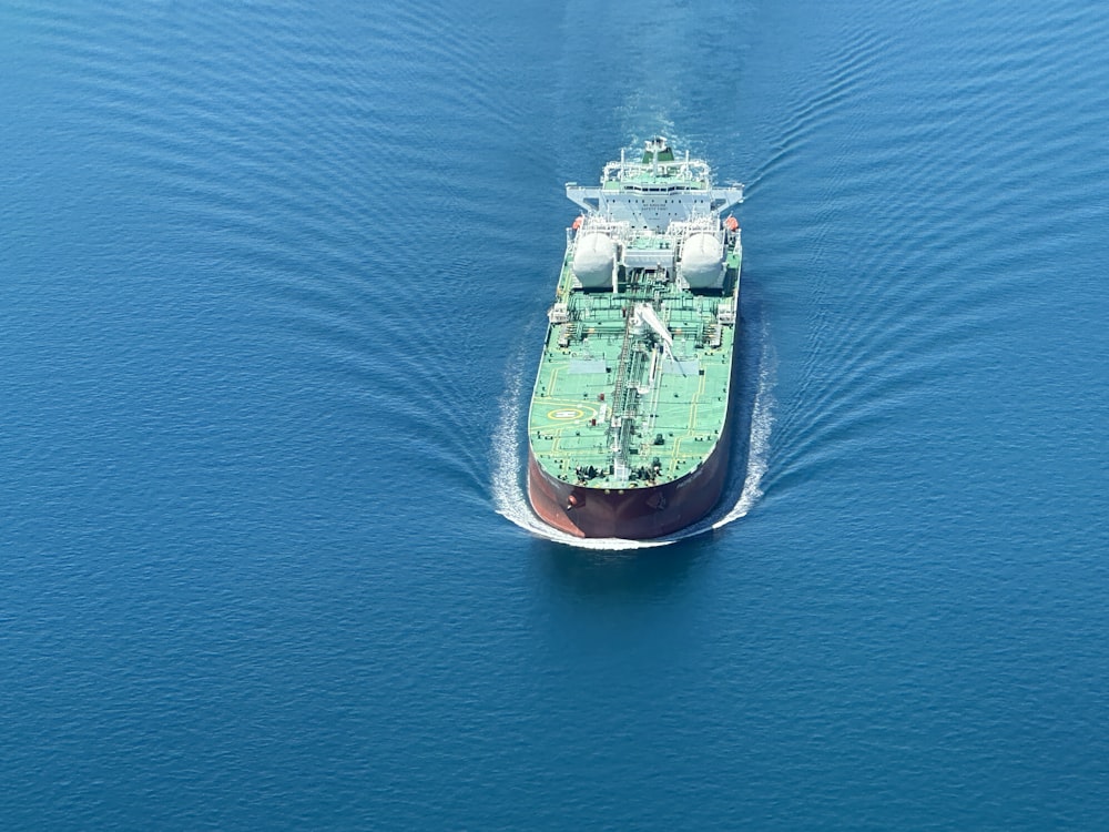 a large cargo ship in the middle of the ocean