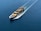 A cargo ship is sailing through a vast expanse of blue water, carrying numerous colorful shipping containers. The ship leaves a trail of waves behind, slicing smoothly through the calm sea.
