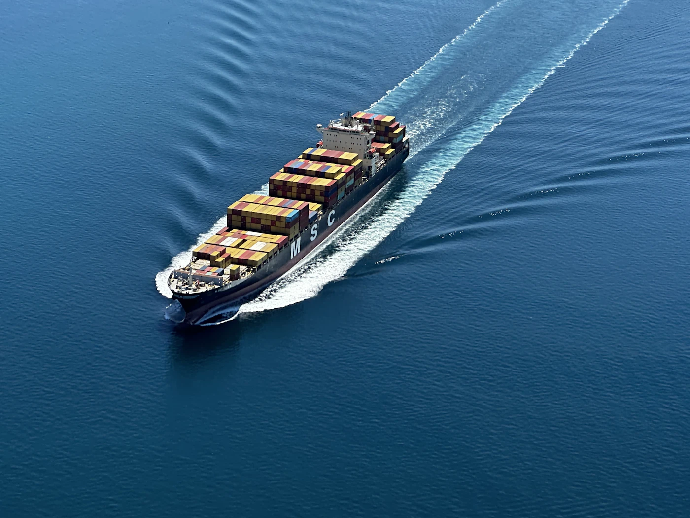A loaded container ship at sea